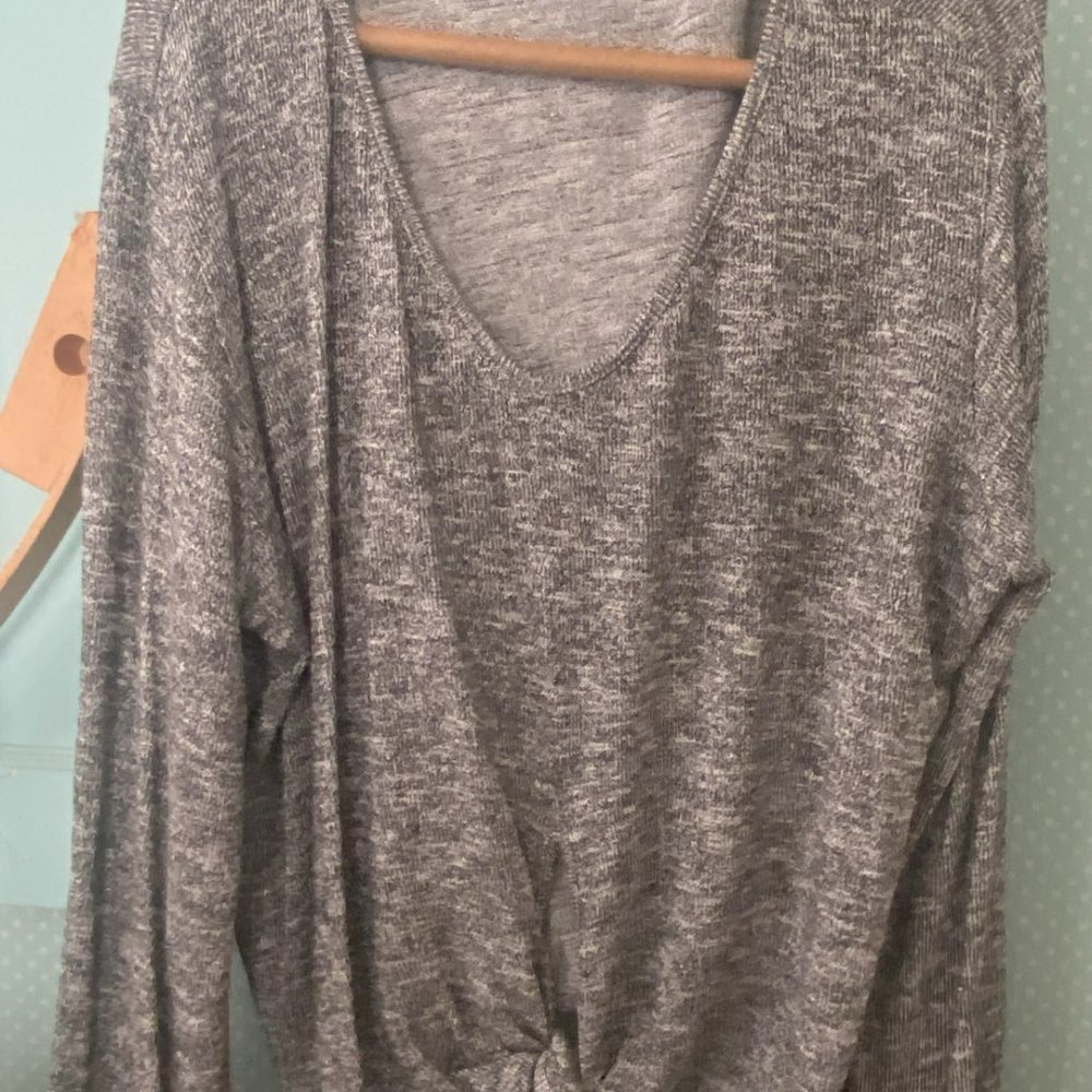 Metallic, silver knit pullover top for women with a tie